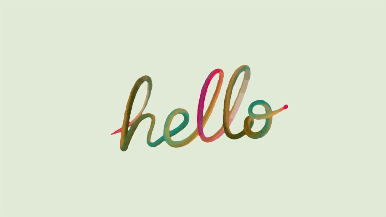 The word "hello" written in a multicolored cursive script against a pale green background.