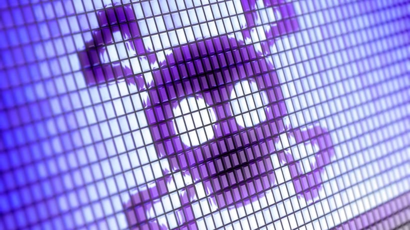 Purple pixelated skull and crossbones symbol displayed on a digital screen with a grid pattern.