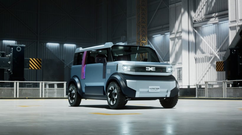 A futuristic compact electric SUV labeled "Hipster Concept" is parked inside a spacious, well-lit industrial warehouse.